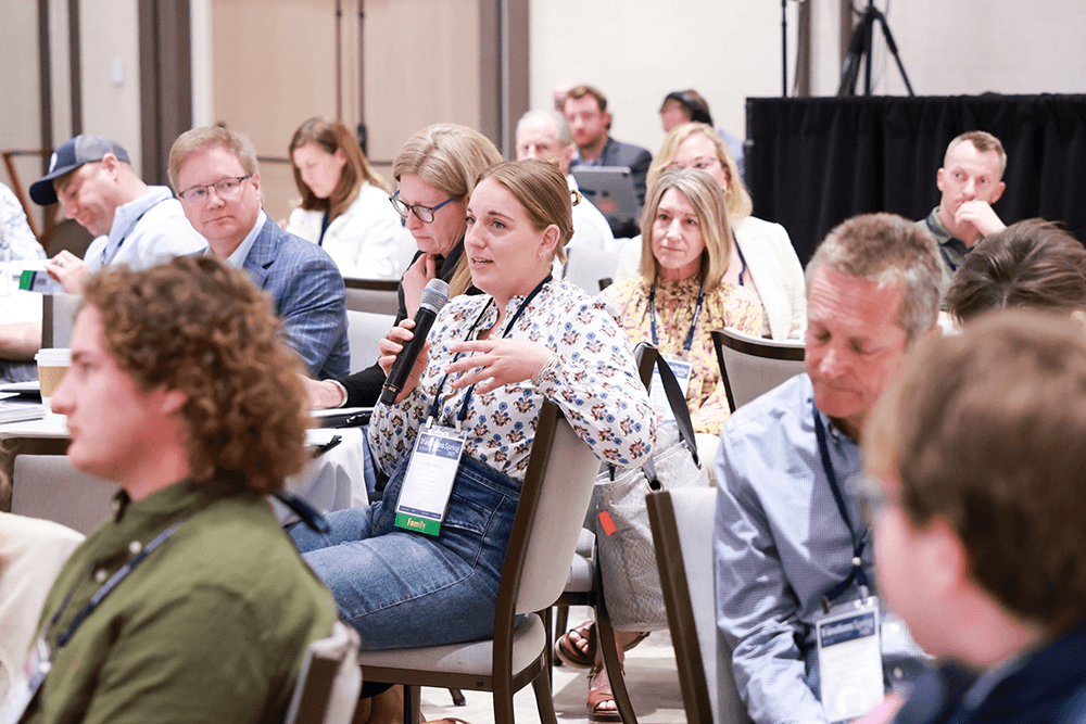 Attendee speaking into microphone