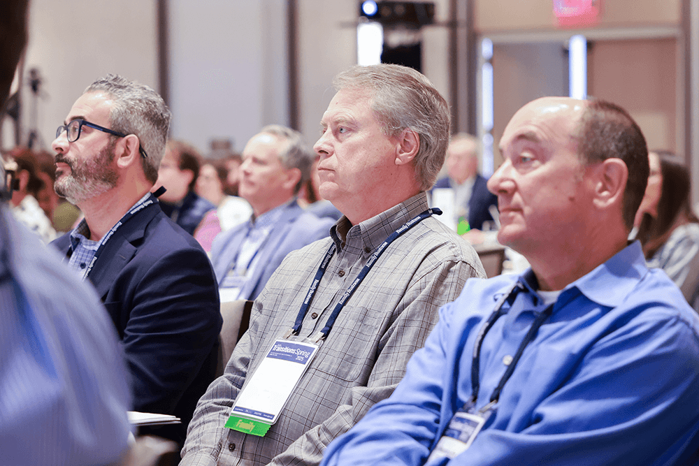 Attendees listening during session